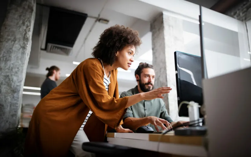 programmers-cooperating-at-it-company-developing-apps-1197257945 Programmers working cooperating at IT company developing apps