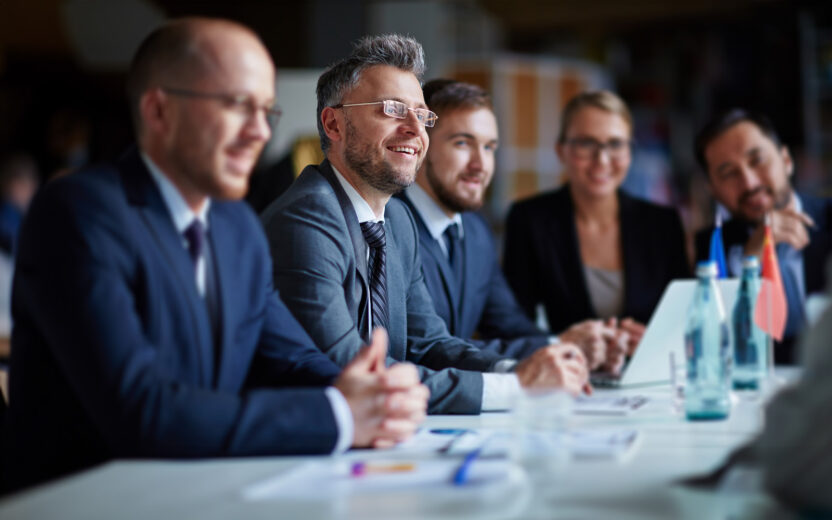 business-group-at-conference-495341828 Successful businesspeople sitting at conference or seminar during lecture