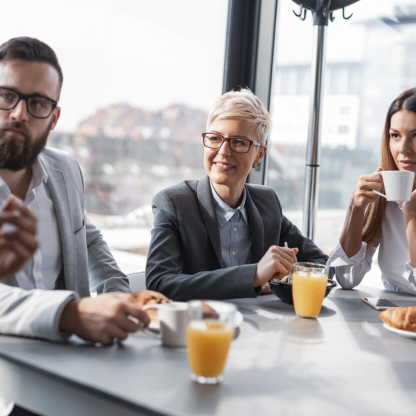 Business people having Breakfast in an office Business people having Breakfast in an office