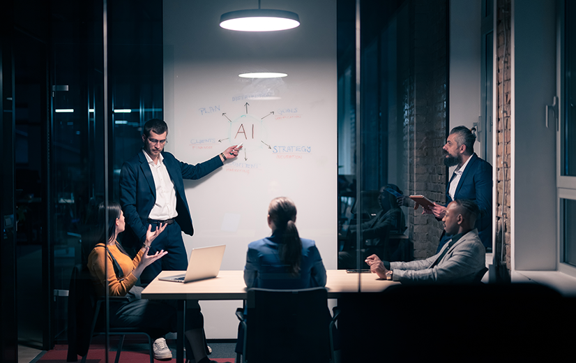 People in business meeting discussing ai in maintenance strategy