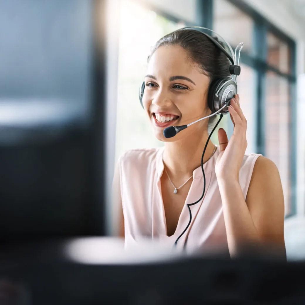 woman-working-in-call-center-1132731920 Cropped shot of a young woman working in a call center